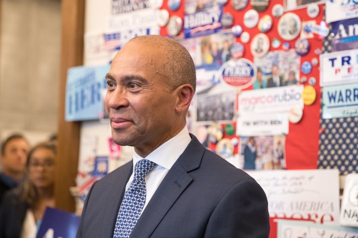 Former Massachusetts Gov. Deval Patrick stands in the visitor center of the New Hampshire State House after he filing his pap