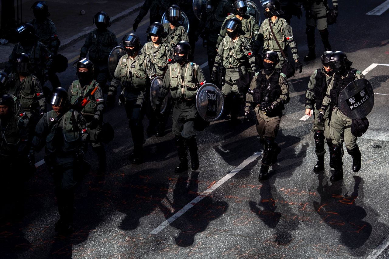 Riot police officers are seen during a protest in Hong Kong's Central District on Friday.