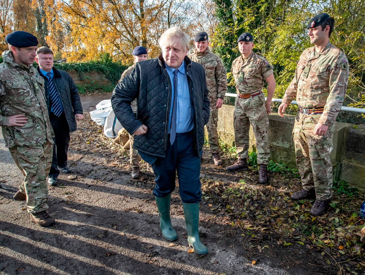 Britain's Prime Minister Boris Johnson walks past members of the Light Dragoons during a visit to Stainforth, near Doncaster, on Wednesday.
