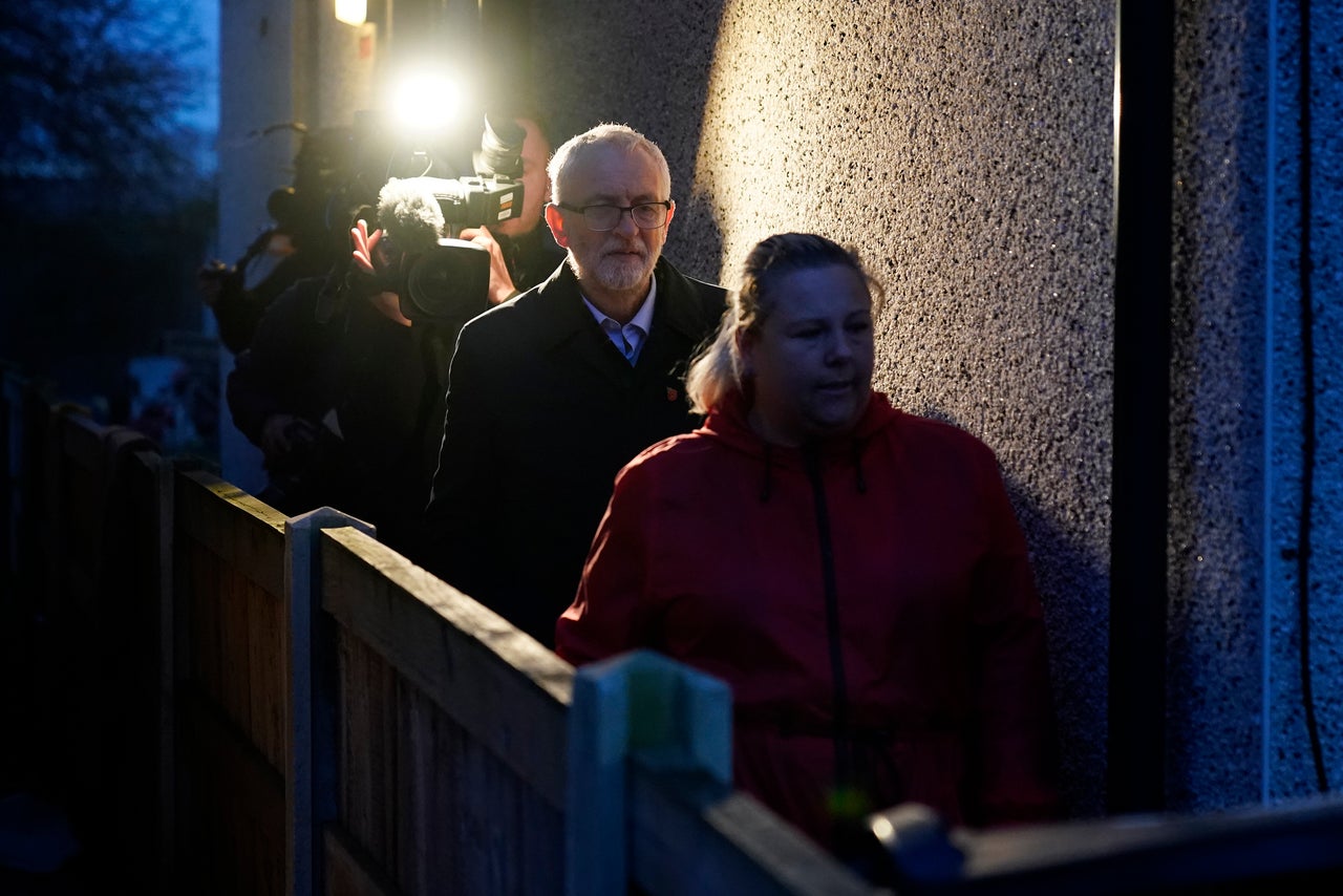 Jeremy Corbyn speaks with flood victims and volunteers in Bentley on Tuesday.