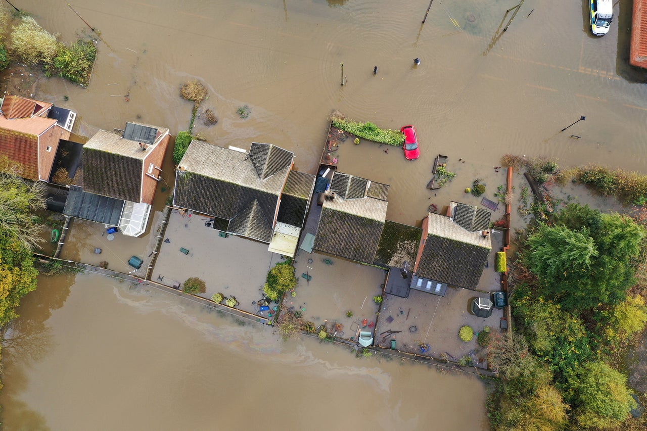 Flood water covers the roads and part of local houses in the Fishlake area on Tuesday.