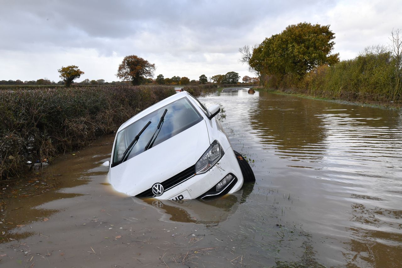 A car sits in flood water in the town of Fishlake on Monday.