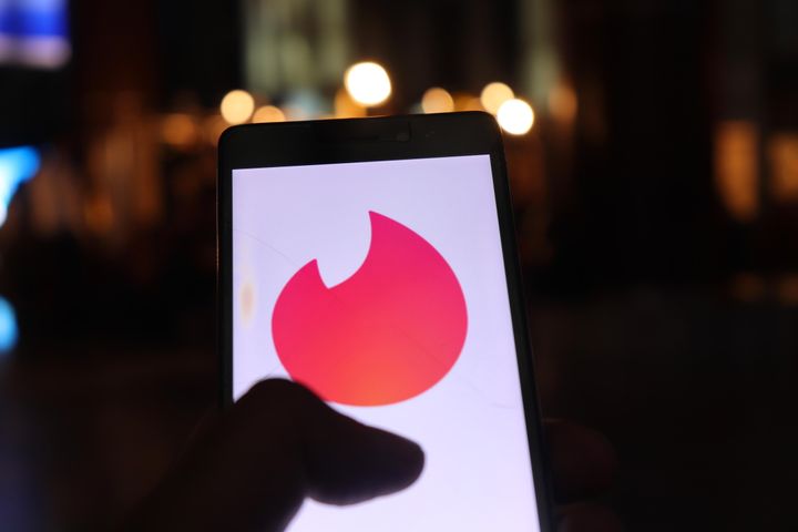 Tinder Logo can be seen on a Mobile Phone in New Delhi, India, on 26 July 2018. Tinder is a location-based social search mobile app that allows users to like or dislike other users, and allows users to chat if both parties swiped to the right. The app is often used as a hookup app (Photo by Nasir Kachroo/NurPhoto via Getty Images)