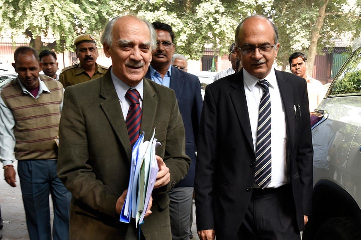 NEW DELHI, INDIA NOVEMBER 14: Former Union Minister Arun Shourie and lawyer-activist Prashant Bhushan walk out of the Supreme Court after the hearing for the probe in to alleged Rafale scam, on November 14, 2018 in New Delhi, India.