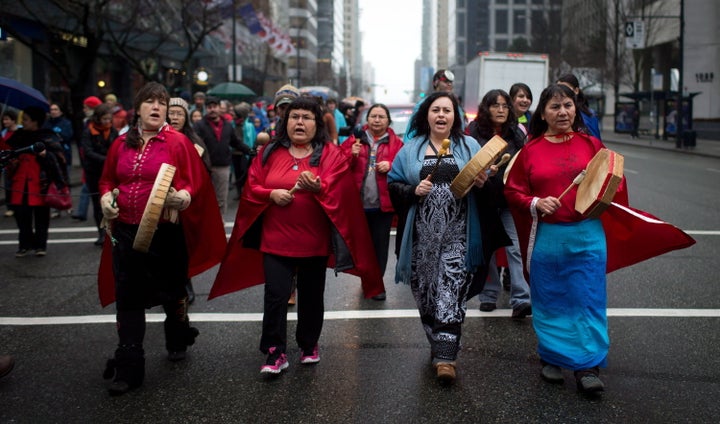 Members of the Chilcotin First Nation march in Vancouver during a protest against Taseko Mines's proposed Prosperity Mine, Dec. 13, 2013.