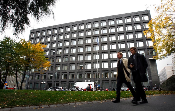 Pedestrians walk past the headquarters of Sweden's Riksbank in Stockholm, Sept. 30, 2008.