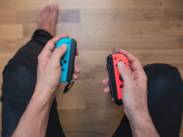 TL;DR: If you ever think you’ll want the ability to play on a TV, you’re better of snagging an original Switch (pictured) rather than the Switch Lite.