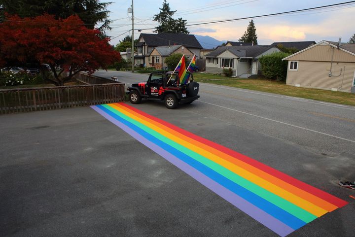 A rainbow crosswalk painted across a Chilliwack driveway.