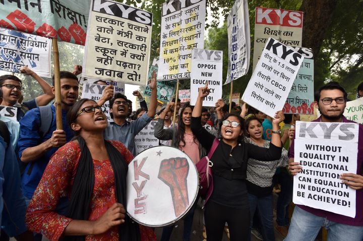Teachers and students from various universities hold placards and shout slogans during a protest march from Mandi House to Jantar Mantar against the New Education Policy and JNU's hostel fee hike on November 14, 2019 in New Delhi.