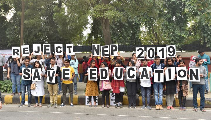 Teachers and students from various universities make a human chain holding placards during a protest march from Mandi House to Jantar Mantar against the New Education Policy and Jawaharlal Nehru University's hostel fee hike on November 14, 2019 in New Delhi.
