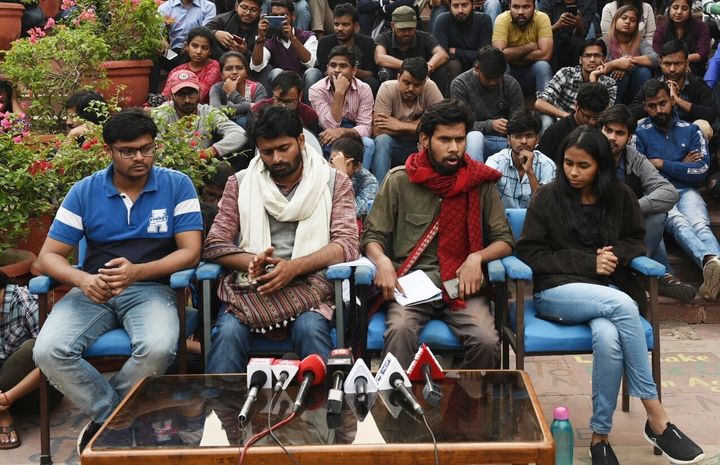 Jawaharlal Nehru University Student Union (JNUSU) Vice President Saket Moon (2R), JNUSU President Aisi Ghosh (R) and other students brief the media outside the admin building while the Executive Council meeting is underway inside the Vice-Chancellors office, at JNU on November 13, 2019 in New Delhi.