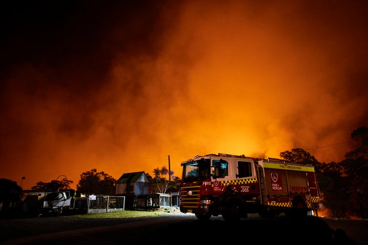 Flames illuminate the sky over a property on Putty road on November 15, 2019 in Colo Heights, Australia.