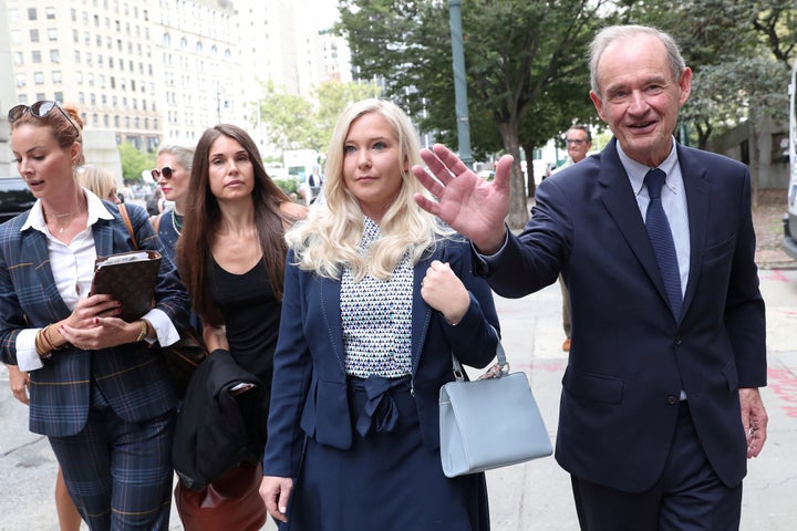 Virginia Giuffre arrives with her lawyer for hearing in the criminal case against Jeffrey Epstein at Federal Court in New York, U.S., Aug. 27, 2019. 