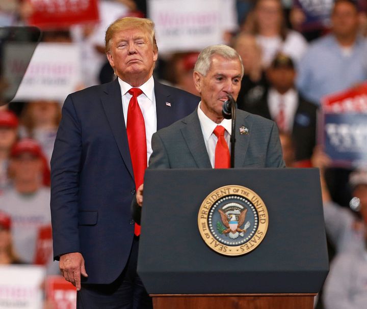 Donald Trump stands behind Republican candidate for governor Eddie Rispone at a Bossier City campaign rally in Louisiana Thursday. Rispone lost Saturday against incumbent Democratic Gov. John Bel Edwards.