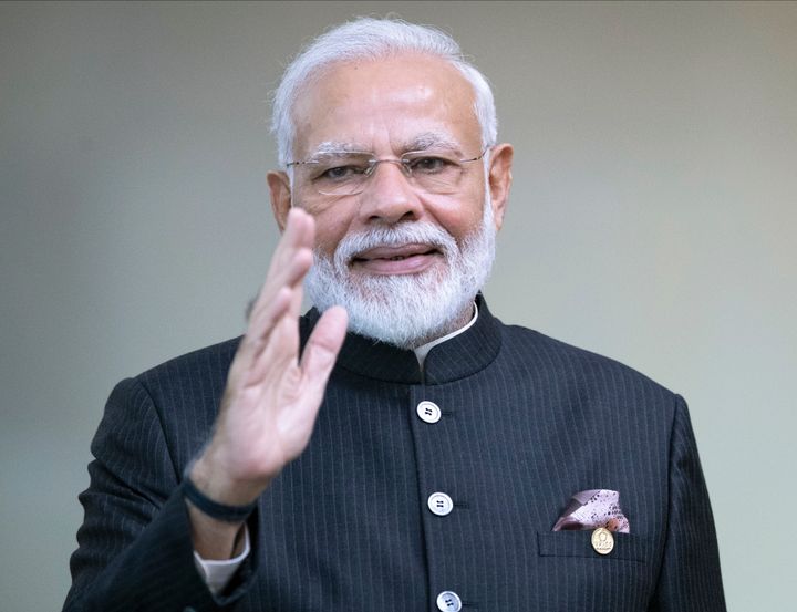 India's Prime Minister Narendra Modi greets the media prior to a meeting of leaders of the BRICS emerging economies at the Itamaraty palace in Brasilia, Brazil, Thursday, Nov. 14, 2019. (AP Photo/Pavel Golovkin, Pool)