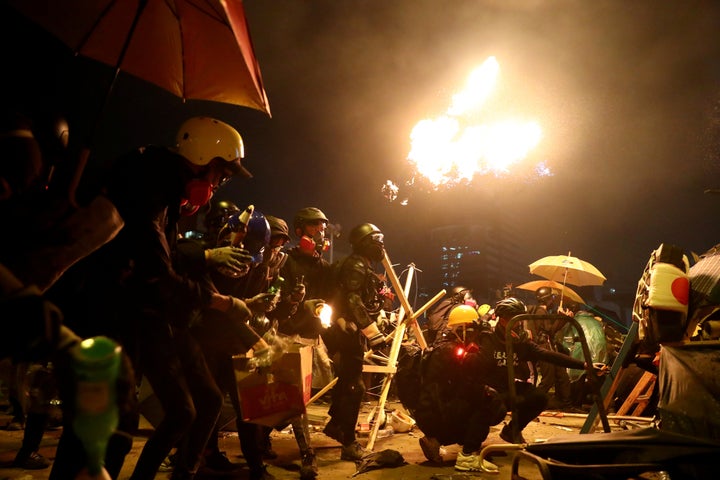 Anti-government protesters prepare molotov cocktails during clashes with police, outside Hong Kong Polytechnic University (PolyU) in Hong Kong, China on November 17, 2019. (REUTERS/Athit Perawongmetha)