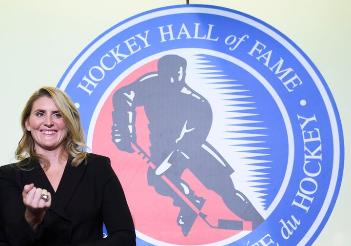 Hockey Hall of Fame inductee Hayley Wickenheiser shows off her ring on stage in Toronto on Friday.