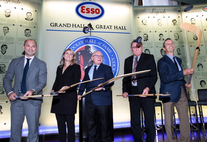 Hockey Hall of Fame inductees Sergei Zubov,left to right, Hayley Wickenheiser, Jim Rutherford, Vaclav Nedomansky and Guy Carbonneau pose for a photograph in Toronto on Friday.