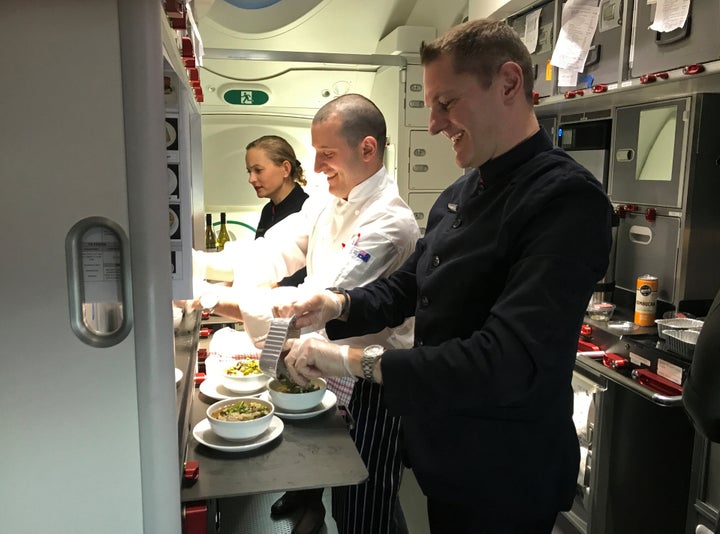 Crew members prepare food on board Qantas flight QF7879, flying direct from London to Sydney, November 14, 2019. Picture taken November 14, 2019. REUTERS/Jill Gralow