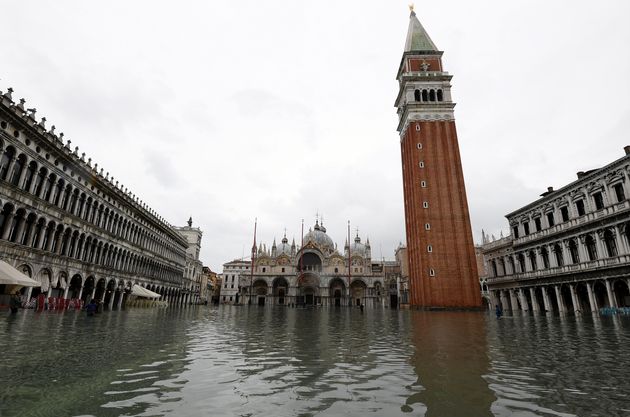 Water floods into St Mark's square as high tide reaches peak, in Venice, Italy on Sunday.