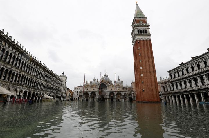 Water floods into St. Mark's square as high tide reaches peak, in Venice, Italy on Nov. 17, 2019. 