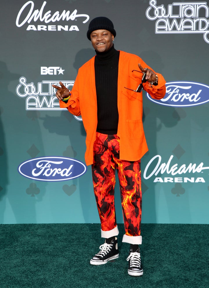 Multiple Grammy nominee BJ The Chicago Kid is orange poppin' in his fun ensemble.