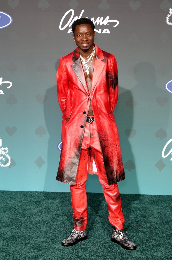 Red alert! Comedian and actor Michael Blackson is on fire in a matching leather long coat and pants. 