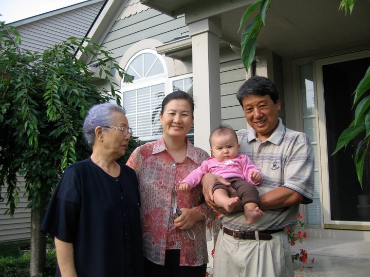 Stanton Lee's daughter, Madigan, with great-grandmother Myung Namm (left), grandmother Mi Ja Lee (center) and grandfather Jai Ho Lee in 2008.