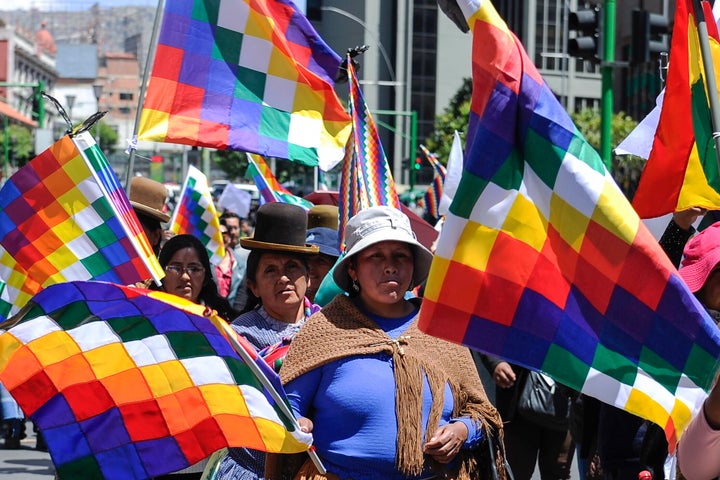 Supporters of Evo Morales carry Wiphala flags that represent Indigenous peoples in La Paz on Nov. 18, 2019.