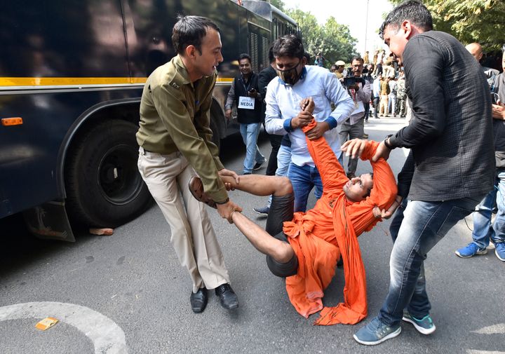 Police detain a student during a protest by the students of JNU against hostel fee hike, near JNU Campus on November 18, 2019 in New Delhi.