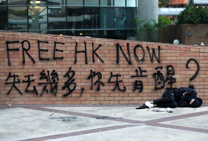 A protester sleeps at the Hong Kong Polytechnic University campus during protests 