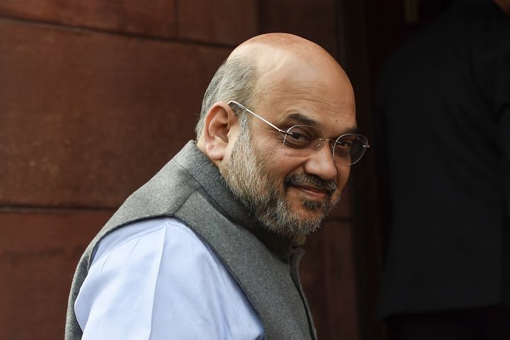 Home Minister Amit Shah looks on after arriving for the winter session of parliament in New Delhi on November 18,2019.