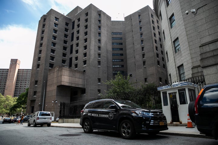 A medical examiner vehicle is seen outside the Metropolitan Correctional Center jail where financier Jeffrey Epstein was foun