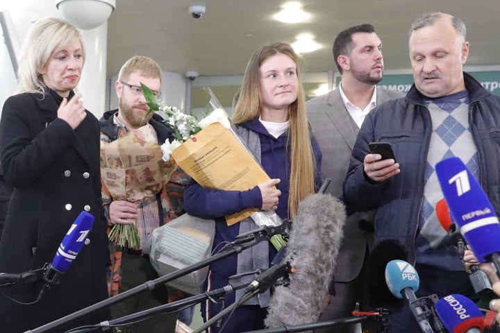 Russian citizen Maria Butina (center) is seen with her father Valery Butin (right) while talking to reporters in Russia follo