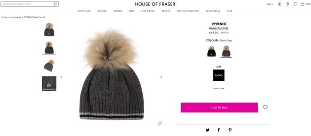 A racoon fur pom-pom hat, available to buy online. 