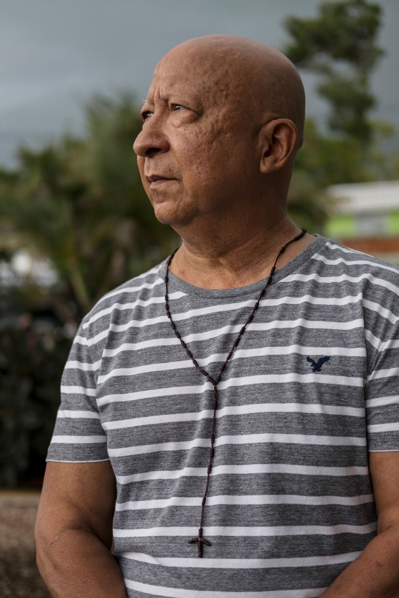 Manases Vega, 65, a retired high school art teacher, poses for a portrait in Salinas.