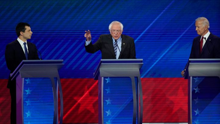 South Bend Mayor Pete Buttigieg, left, and former Vice President Joe Biden, right, listen as Sen. Bernie Sanders, I-Vt., center, speaks Thursday, Sept. 12, 2019, during a Democratic presidential primary debate hosted by ABC at Texas Southern University in Houston. 