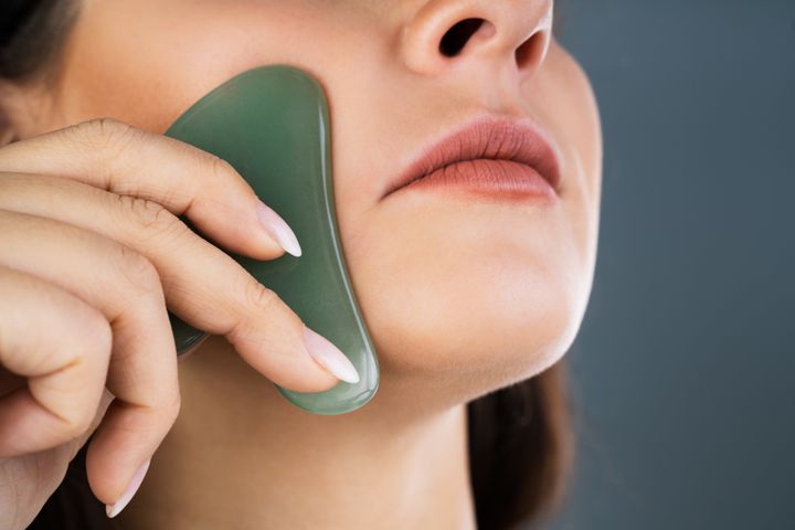 A gua sha tool is meant to be gently pressed all over your neck, face and décolletage.