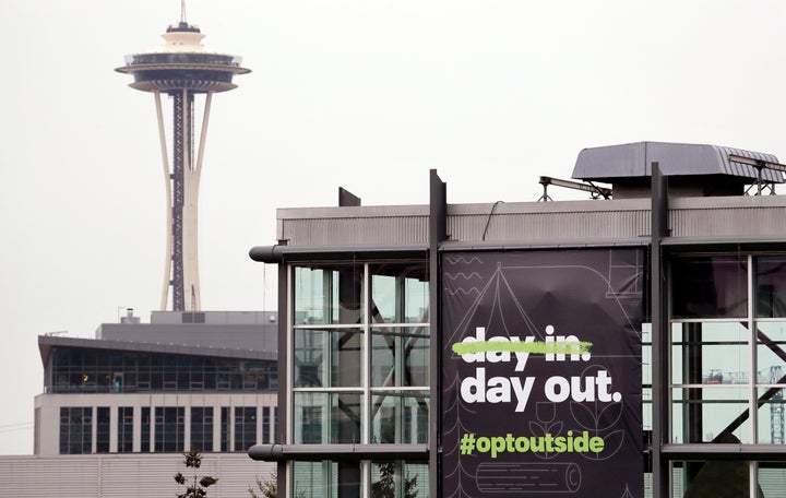 REI's flagship Seattle store with a banner announcing its plan to close on Black Friday 2018.