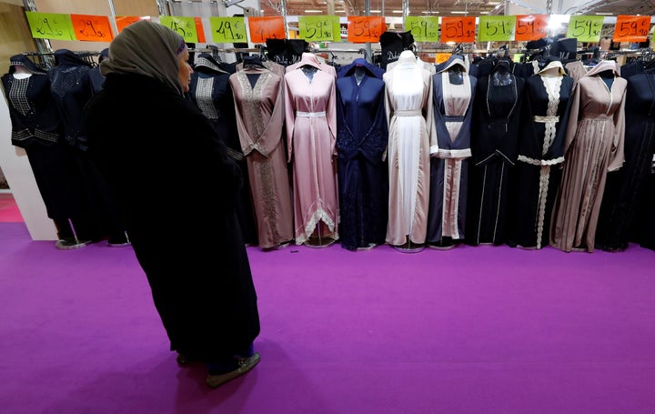 A visitor looks at women's clothes during a meeting organized by the Union of Islamic Organizations of France at Le Bourget, near Paris, in March 2018.