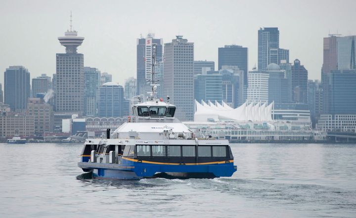 Downtown Vancouver is pictured in the background as a Seabus leaves North Vancouver, B.C. on Wednesday, Feb. 4, 2015. 
