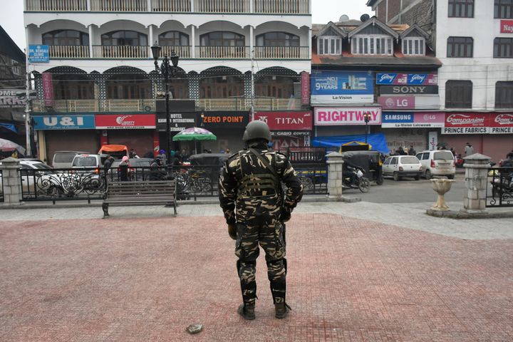 An Indian paramillitary trooper stands in city centre Lal chowk as shutdown continues in parts of Srinagar, Indian Administered Kashmir on 21 November 2019. (Photo by Muzamil Mattoo/NurPhoto via Getty Images)