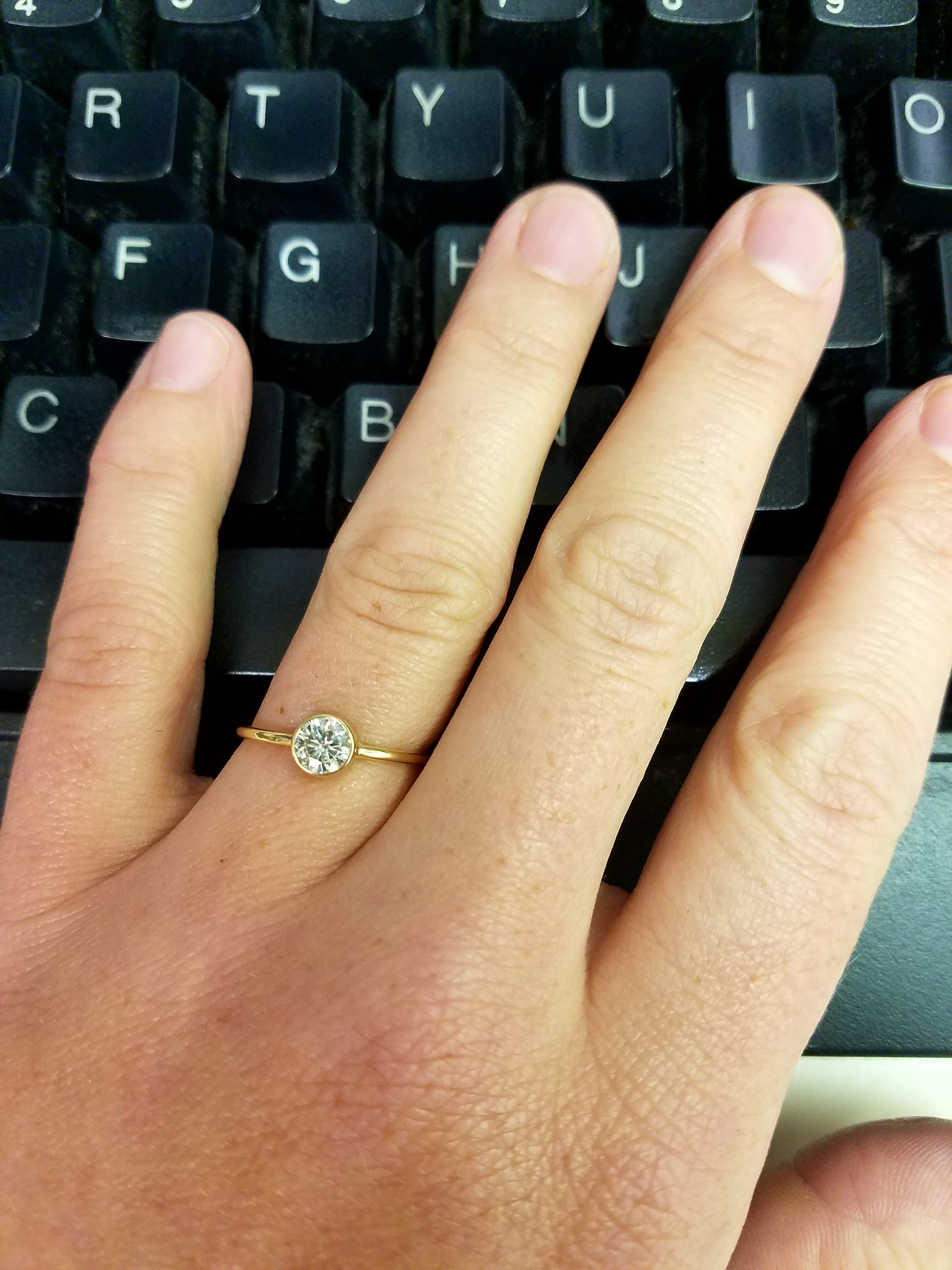 very small diamond engagement ring