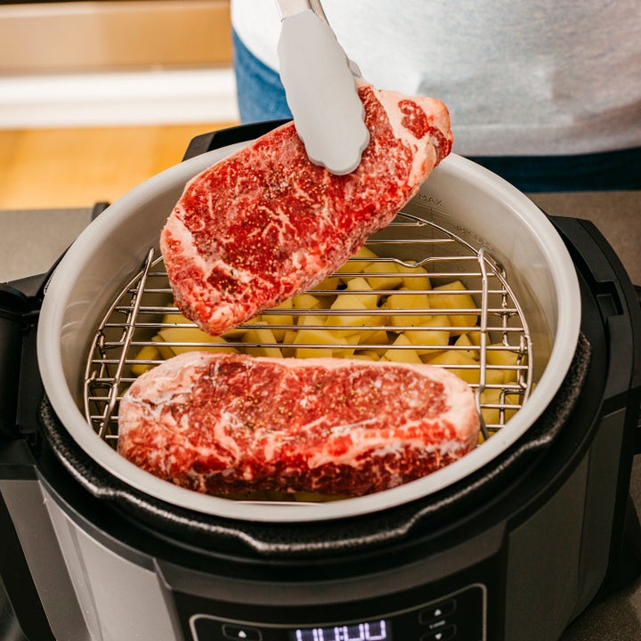 The Ninja Foodi does the work of a pressure cooker, air fryer, steamer and slow cooker all in one. Get it on sale at Walmart right now for $180.