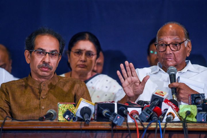 Shiv Sena party Chief Uddhav Thackeray (L) looks on as Nationalist Congress Party (NCP) Chief Sharad Pawar speaks at a press conference in Mumbai on November 23, 2019. - Indian Prime Minister Narendra Modi's party made an unexpected comeback to power on November 23 in wealthy Maharashtra state, home to the country's financial capital, after prolonged backroom negotiations saw presidential rule lifted after days of uncertainty. (Photo by Indranil MUKHERJEE / AFP) (Photo by INDRANIL MUKHERJEE/AFP via Getty Images)