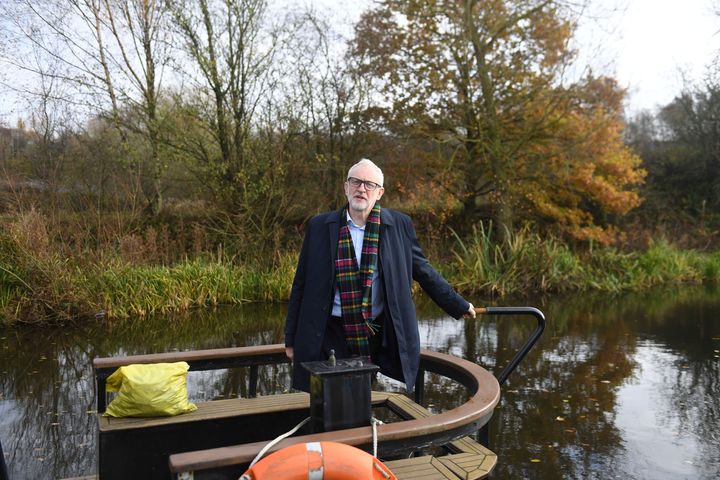 Jeremy Corbyn stands on The Oatcake Boat owned by Kay Mundy in Stoke-on-Trent, England, Friday Nov. 22, 2019.