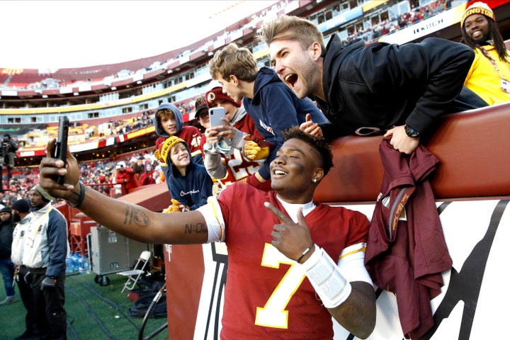 Dwayne Haskins said he didn't realize that the game was still going on when he began taking selfies with fans.