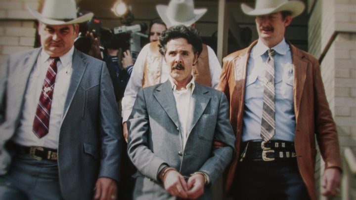 Henry Lee Lucas (centre) being escorted by Ranger Bob Prince (left) and task force in footage from "The Confession Killer."