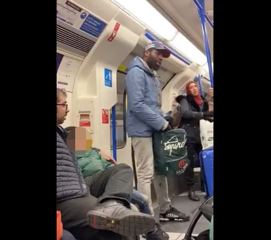 A screengrab of a viral Twitter video shows a Jewish father and son (left) who were reportedly targeted in an anti-Semitic rant by a man quoting Bible passages (center) on a London subway car on Friday.