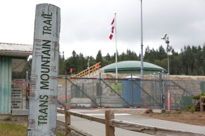 A marker for the Trans Mountain Trail is pictured outside a Kinder Morgan terminal and tank farm in Burnaby, B.C. on June 20, 2019.